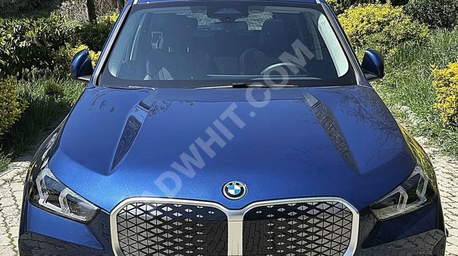 سيارة İX1 eDrive20 X-Line / بمسافة 8,000 كم/ فرش جلدي باللون الموكا