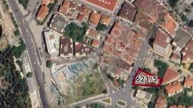 A plot of land with a shared informal building, very close to Halkalı Square.