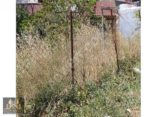 A plot of land with a shared informal building, very close to Halkalı Square.