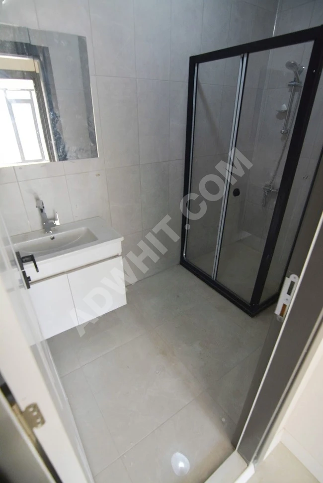 An apartment in the BUTİK complex, completely new, with a parking space, elevator, and on a middle floor.