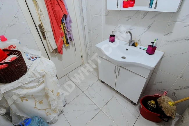 Spacious 3+1 apartment with a balcony, close to the street, for sale by BÜŞRA Real Estate Company.