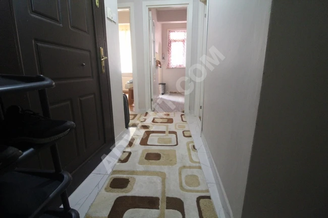Spacious 3+1 apartment with a balcony, close to the street, for sale by BÜŞRA Real Estate Company.