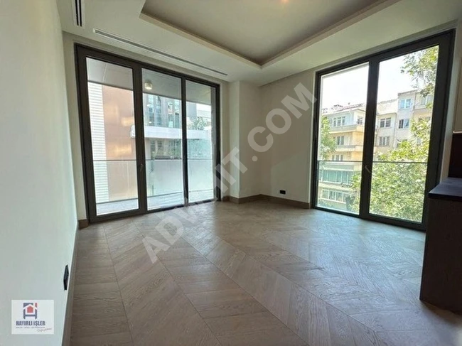 Large 1+1 apartment for sale in DAP YAPI NİŞANTAŞI KORU with balcony - corner apartment