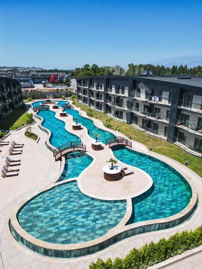 Antalya - Lara'da denize yakın, yatırım için satılık, yeni, lüks 3+1 daire.