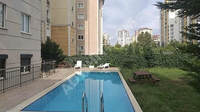 ÖNÜ AÇIK AYRI MUTFAKLI OTOPARKLI 2+1 HAVUZLU SATILIK DAİRE