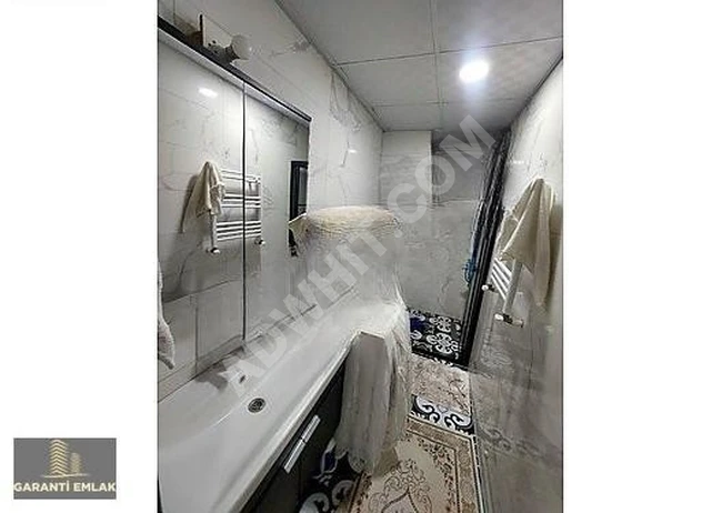 شقة 2+1 بمساحة 56 متر مربع، مع حديقة، الطابق الأرضي، في حي FEVZİÇAKMAK