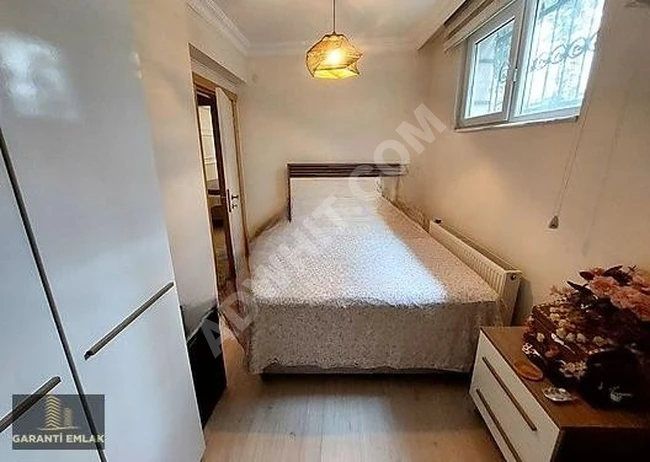 شقة أرضية 2+1 بمساحة 80 متر مربع، مع استخدام حديقة وموقع ممتاز.