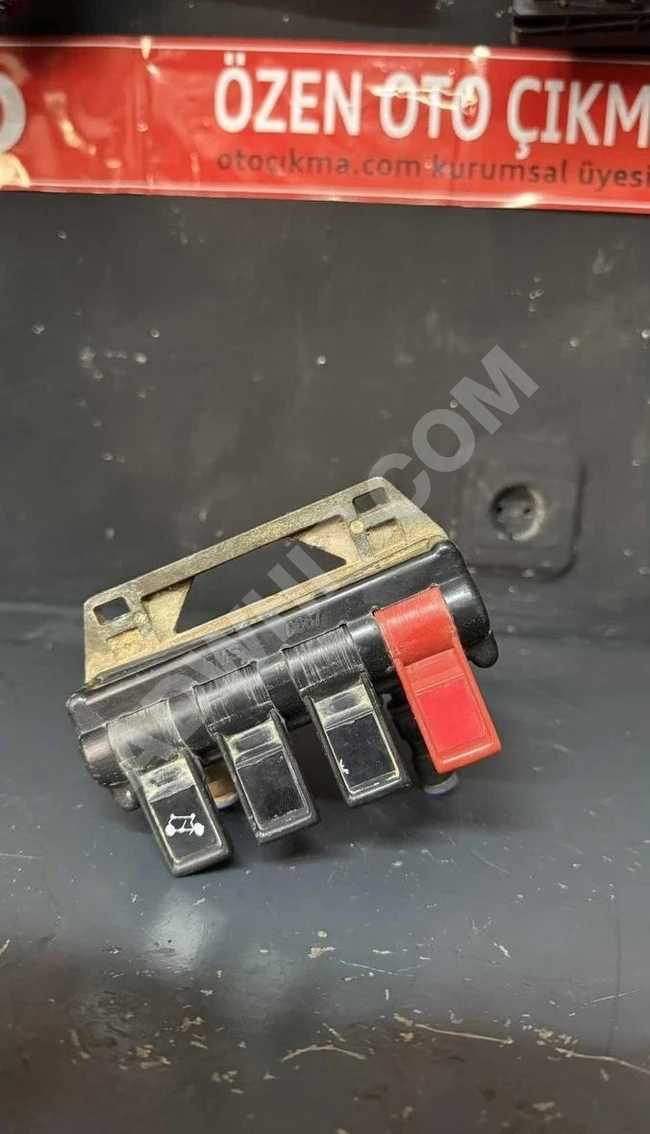 Original spoiler lift control buttons (used)