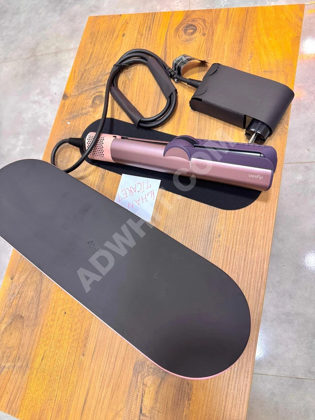 مجموعة مكواة فرد الشعر دايسون باللون الوردي الداكن