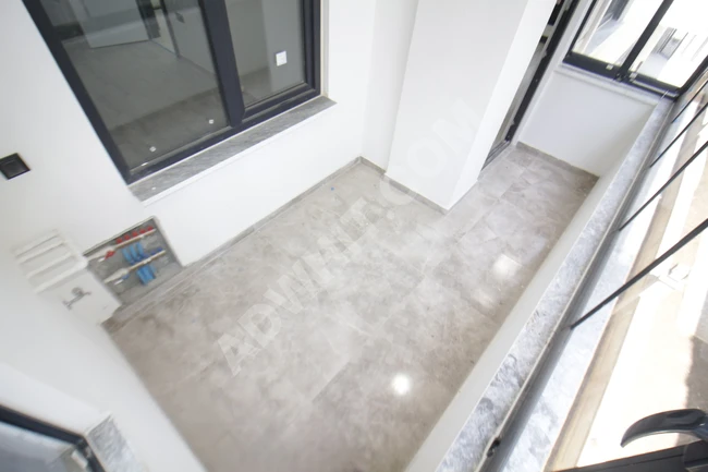 ALTINKUMDA DOGALGAZLI ASANSÖRLÜ GENİŞ BALKONLU SIFIR 1+1 DAİRE