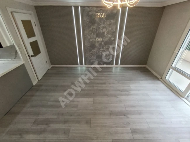 A stylish 2+1 apartment in Altinkum with natural gas, a huge balcony, and fully renovated.