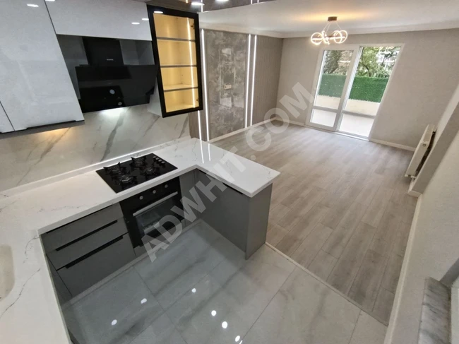 A stylish 2+1 apartment in Altinkum with natural gas, a huge balcony, and fully renovated.