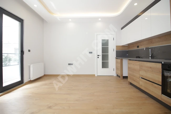 1+1 brand new luxury apartment with natural gas, elevator, and intermediate floor in Altinkum