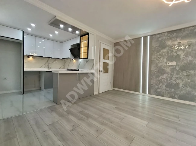 A stylish 2+1 apartment in Altinkum with natural gas, a huge balcony, and fully renovated.