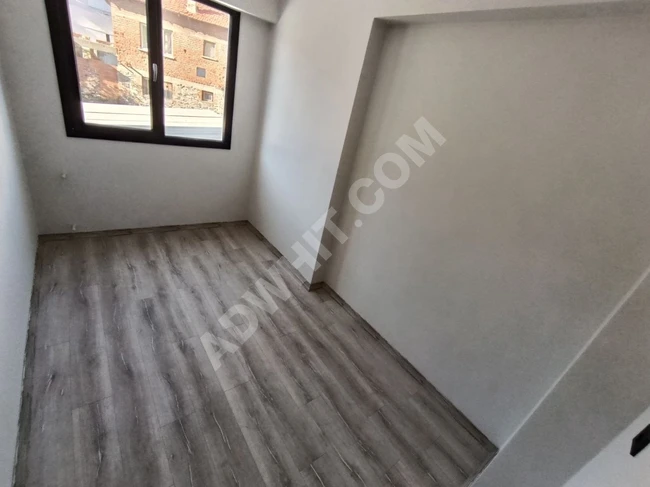 A 2+1 front-facing, brand new, independent-type property with a covered parking lot in Zeytinli.