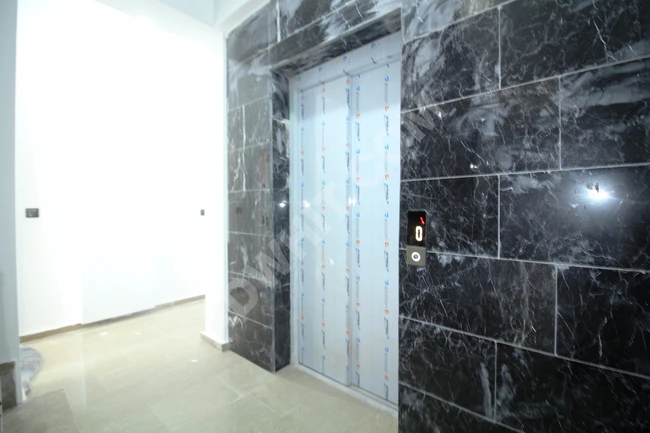 Brand new luxury 2+1 apartment in Altinkum with natural gas, elevator, and glass balcony